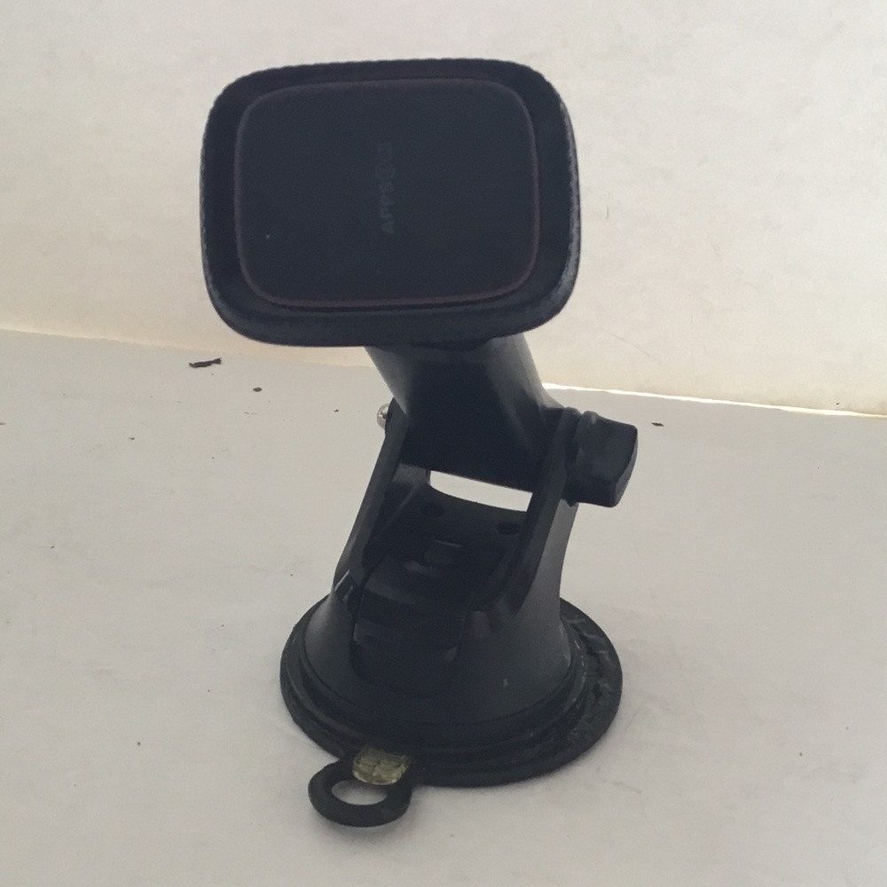 Cell phone holder for car dashboard. Magnetized.